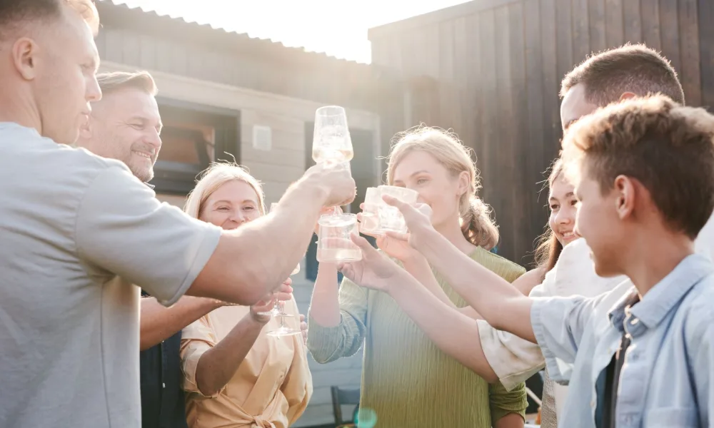 large family gathering with drinks and a bin full of nugget ice