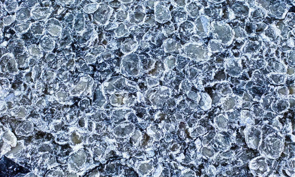 interior of ice maker frozen solid with ice buildup