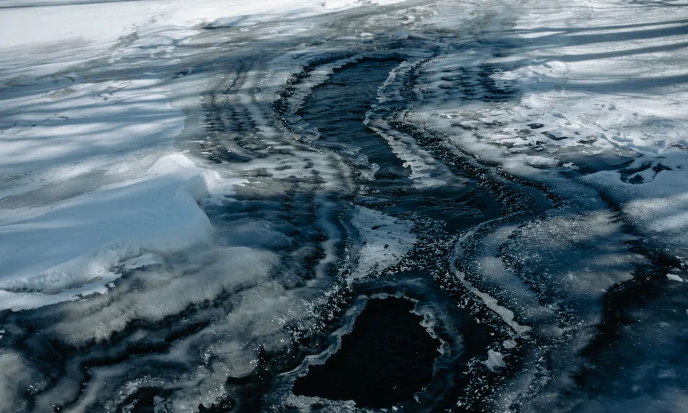 melted ice water pooling in countertop ice maker storage bin
