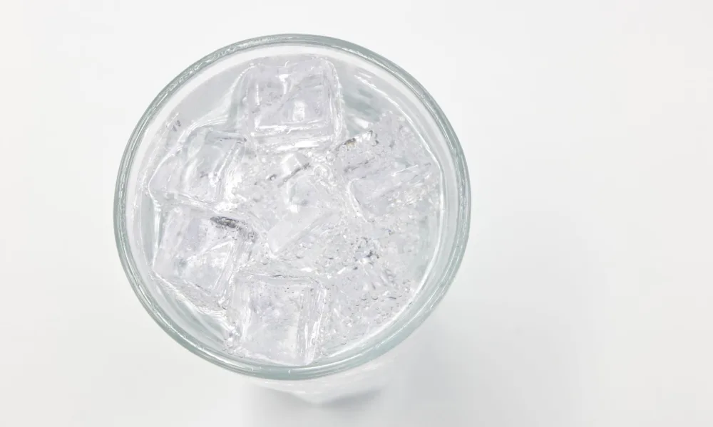 countertop nugget ice maker with pebble ice in glass