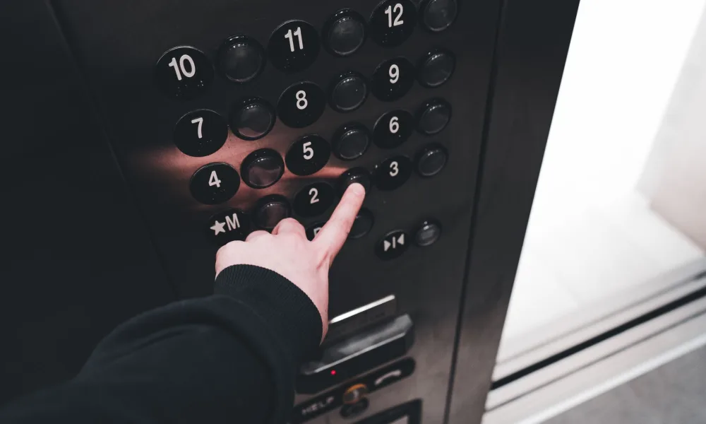 finger pressing clean button on nugget ice maker control panel