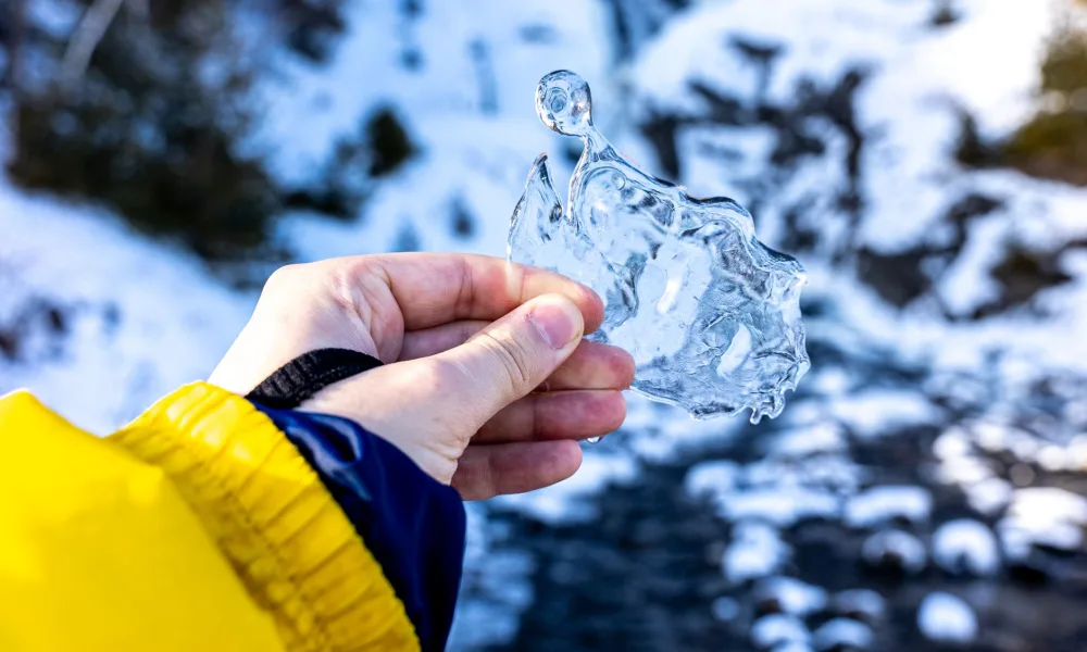hand holding soft nugget ice pieces closeup